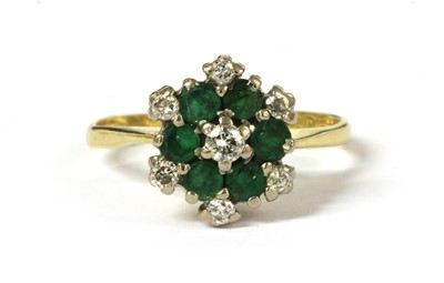 Lot 127 - An 18ct gold diamond and emerald cluster ring
