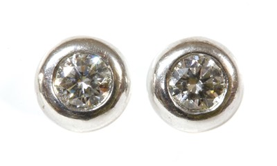 Lot 337 - A pair of 18ct white gold diamond stud earrings