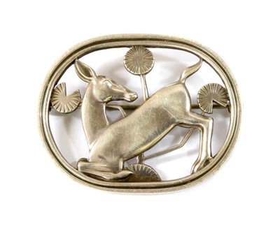 Lot 383 - A sterling silver kneeling deer brooch, by Georg Jensen
