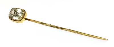 Lot 236 - A yellow metal topaz stick pin