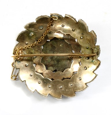 Lot 14 - A Victorian circular Bohemian garnet brooch