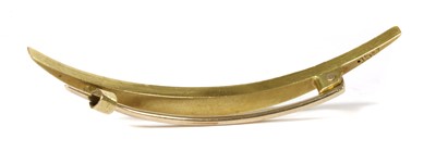 Lot 26 - An Edwardian gold split pearl open crescent brooch