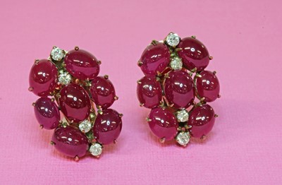 Lot 196 - A pair of cabochon ruby and diamond earrings, c.1945