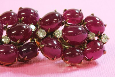 Lot 196 - A pair of cabochon ruby and diamond earrings, c.1945