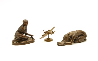 Lot 148 - A bronze of a girl rolling dice