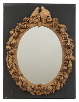 Lot 102A - An ornately carved mirror in the style of Grinling Gibbons