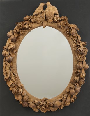 Lot 102 - An ornately carved mirror in the style of Grinling Gibbons