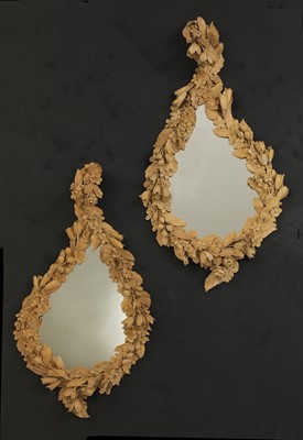Lot 346 - A pair of carved mirrors in the style of Grinling Gibbons