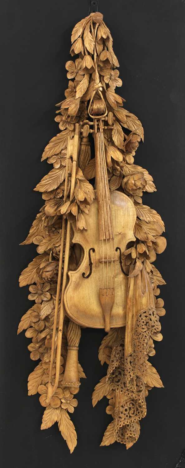 Lot 951 - A carved wall hanging in the style of Grinling Gibbons