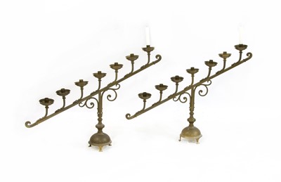 Lot 111 - A pair of brass church altar candlesticks