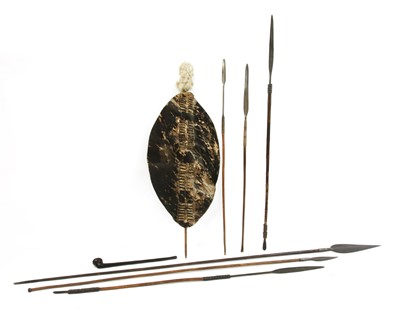 Lot 99F - Six various Southern African tribal spears or assegais, a Maasai throwing club and an ox-hide shield