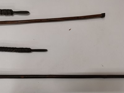 Lot 99 - Six various Southern African tribal spears or assegais, a Maasai throwing club and an ox-hide shield