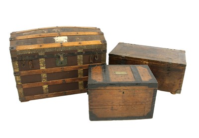 Lot 94 - A domed top trunk containing military equipment