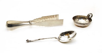 Lot 281 - A pair of Dutch 833 standard silver asparagus tongs, spoon and tasse du vin (3)