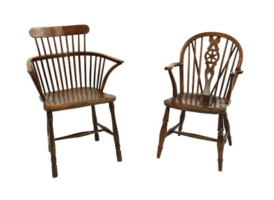 Lot 707 - Two 19th century and later yew wood Windsor elbow chairs