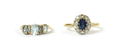 Lot 138 - A gold sapphire and diamond cluster ring