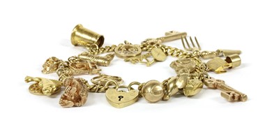 Lot 128 - A gold charm bracelet