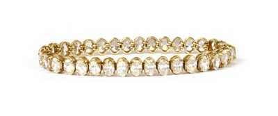 Lot 153 - A gold cubic zirconia line bracelet