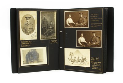 Lot 99M - Military interest. A modern photograph album containing over 160 photos and postcards