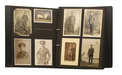 Lot 99K - An album of over 80 original photographs and postcards of soldiers