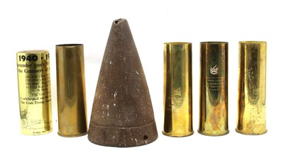 Lot 99 - Four brass commemorative shellcases and an iron shell cone.
