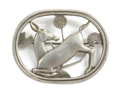 Lot 264 - A sterling silver kneeling deer brooch, by Georg Jensen