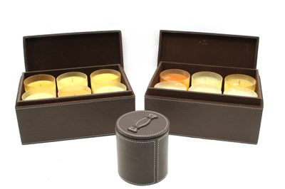 Lot 401 - Four leather boxed sets of scented candles, a leather cased single candle and a tidy box (6)