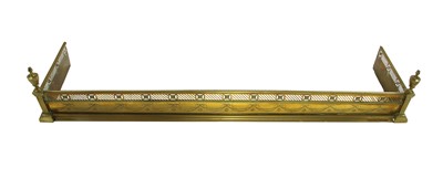 Lot 629 - An Edwardian brass fender