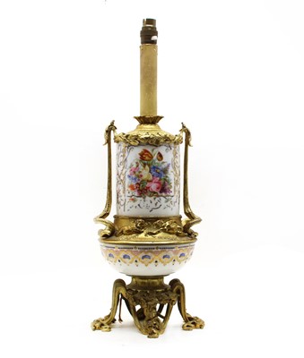 Lot 216 - A Continental porcelain and gilt metal table lamp