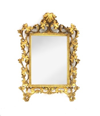 Lot 569 - A Venetian style carved and gilt wall mirror