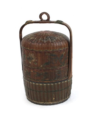 Lot 282 - A Chinese cylindrical multi layer rice box with loop handle