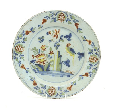 Lot 253 - An 18th century Lambeth Delft tin glazed charger