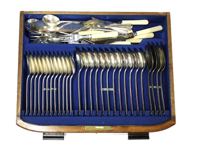 Lot 170 - An Art Deco walnut canteen of silver-plated cutlery