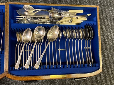 Lot 170 - An Art Deco walnut canteen of silver-plated cutlery