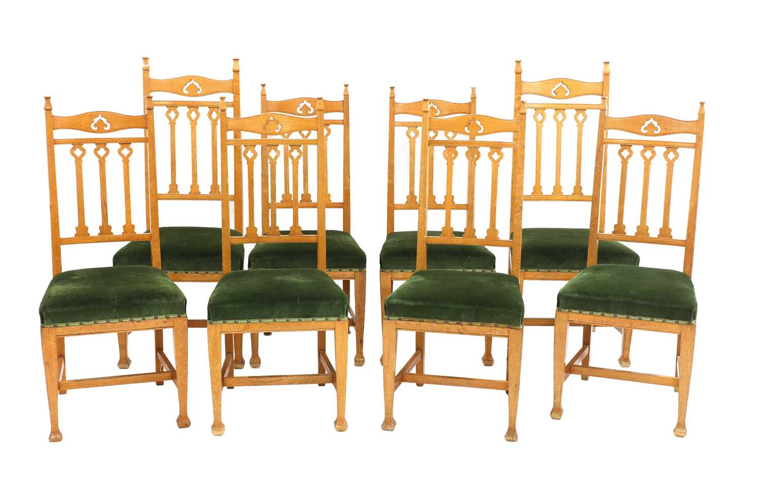 Lot 51 - A set of eight Arts and Crafts oak dining chairs