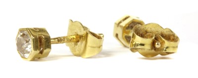 Lot 42 - A pair of 18ct gold single stone diamond stud earrings
