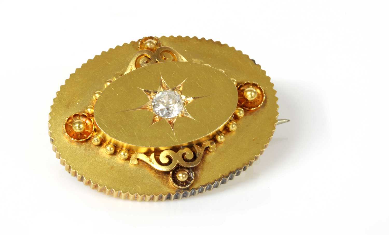 Lot 68 - A Victorian gold diamond set oval shield form brooch, c.1870