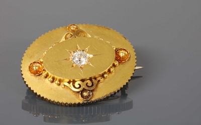 Lot 68 - A Victorian gold diamond set oval shield form brooch, c.1870
