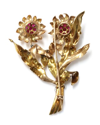 Lot 194 - A three colour gold, ruby and diamond spray brooch, c.1940