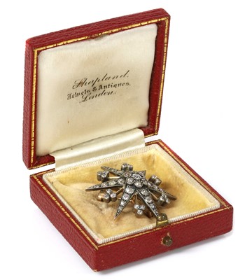 Lot 59 - A late Victorian diamond set star brooch/pendant, c.1890