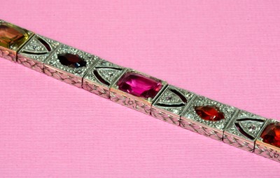Lot 154 - An American Art Deco assorted gemstone and diamond bracelet, c.1925