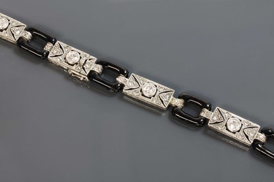 Lot 164 - An American Art Deco diamond and enamel bracelet, c.1920