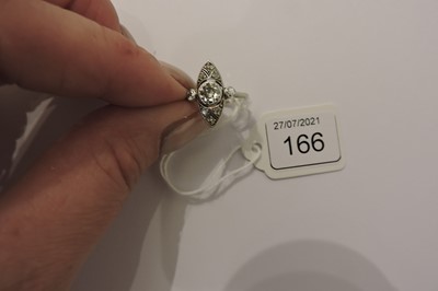 Lot 166 - An Art Deco platinum marquise shaped diamond set ring