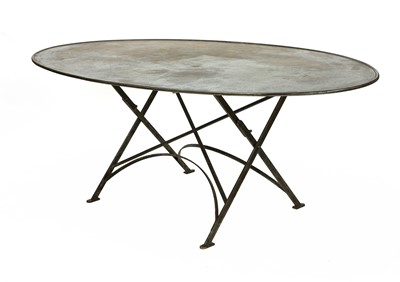 Lot 485 - An oval steel folding dining table