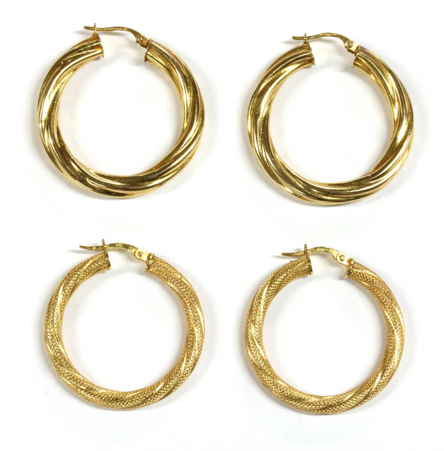 Lot 82 - Two pairs of 9ct gold hollow hoop earrings