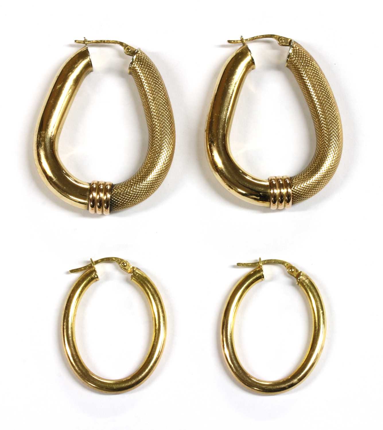 Lot 83 - Two pairs of 9ct gold hollow hoop earrings