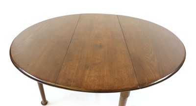 Lot 295 - A George lll oval walnut two flap table