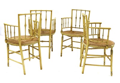 Lot 218 - A set of four painted Regency-style elbow chairs