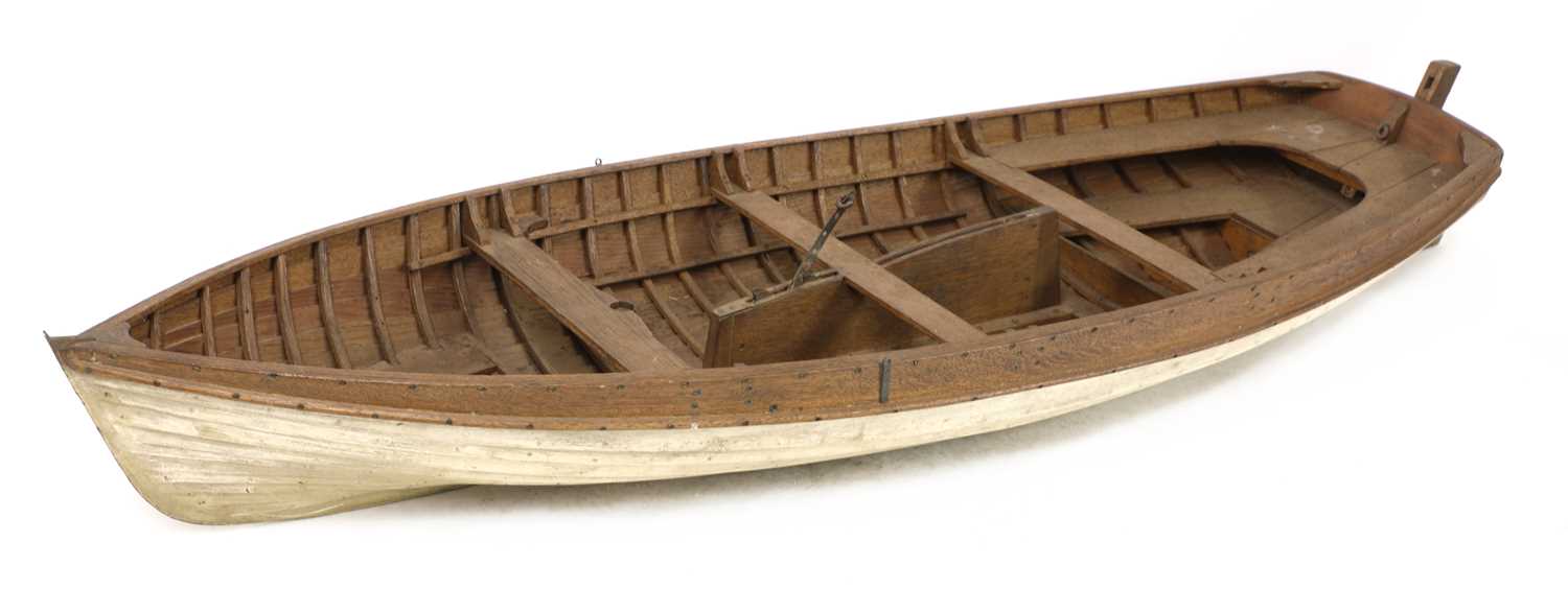 Lot 675 - A wooden model rowing boat,