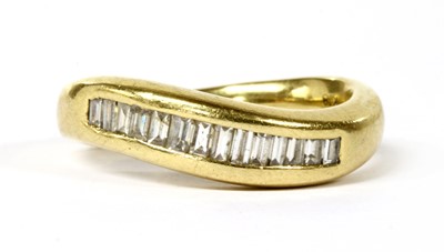 Lot 126 - An 18ct gold diamond half eternity ring